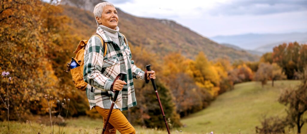 Woman walking on a quiet path, symbolizing taking the next honest step after 50.